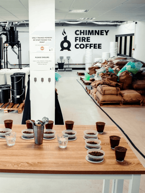chimney fire coffee roastery cupping table set up
